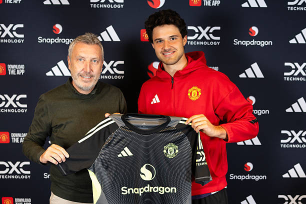 Click image for larger version

Name:	manchester-england-senne-lammens-of-manchester-united-poses-with-director-of-football-jason.jpg
Views:	2
Size:	79.2 KB
ID:	36474